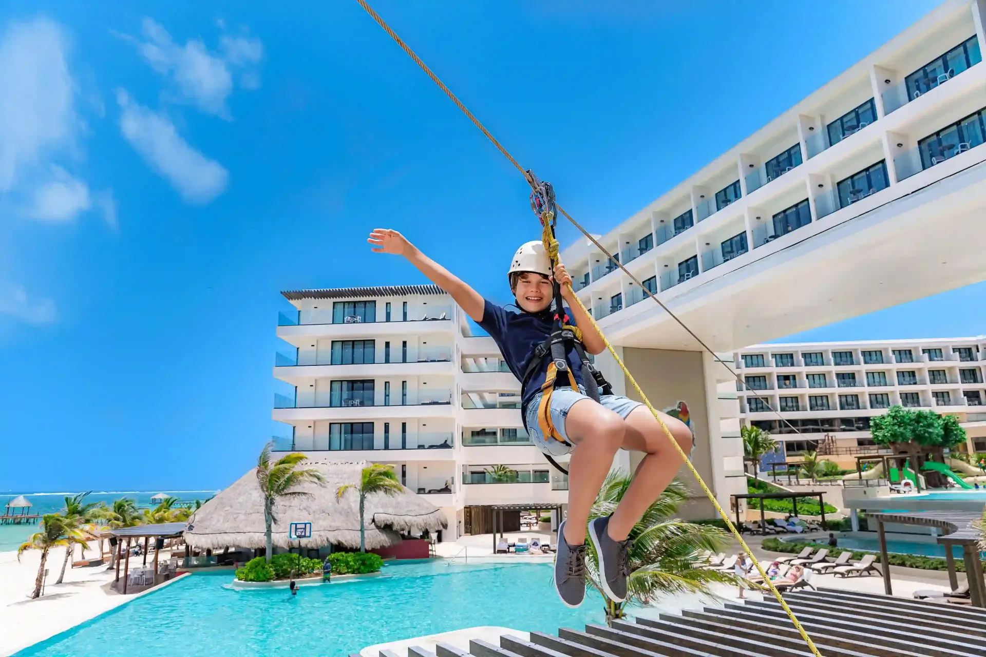 Child on zipline at Sensira Resort